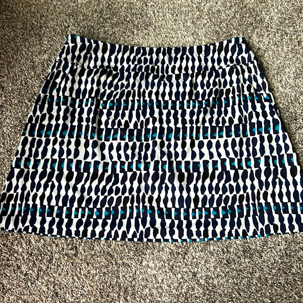 Tail golf skort in black, white and turquoise